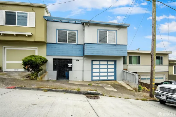 a view of a car parked in front of a house