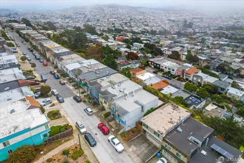 an aerial view of a city with lots of residential buildings