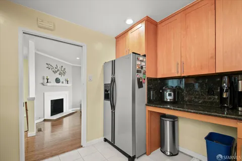 a kitchen with stainless steel appliances a refrigerator and a microwave