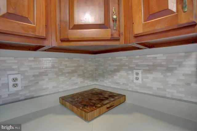 a kitchen with stainless steel appliances granite countertop a refrigerator sink and stove