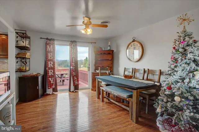 a bedroom with a bed a window and a flat screen television