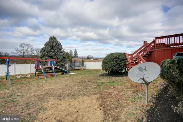 a backyard of a house with yard and garage