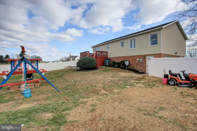 a view of a backyard of the house