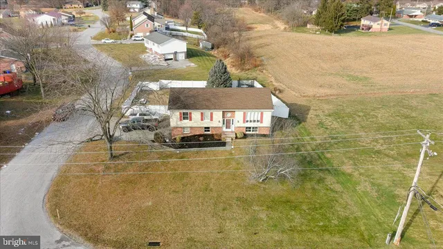 a view of a swimming pool and a yard
