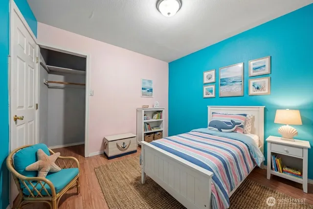 a bedroom with a bed and a couch