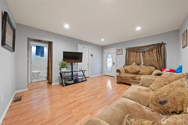 a bed room with a bed window and a television