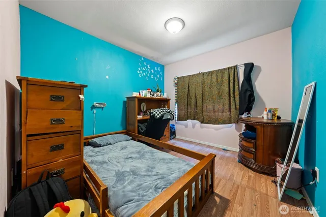 a bedroom with a bed and furniture