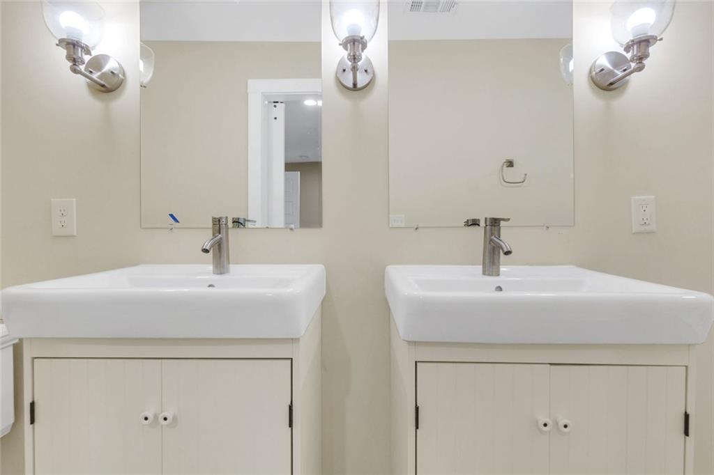 998 Mayson Turner Road Northwest, Unit A Atlanta, GA 30314 - Photo 15 of 26 a bathroom with a sink and a mirror