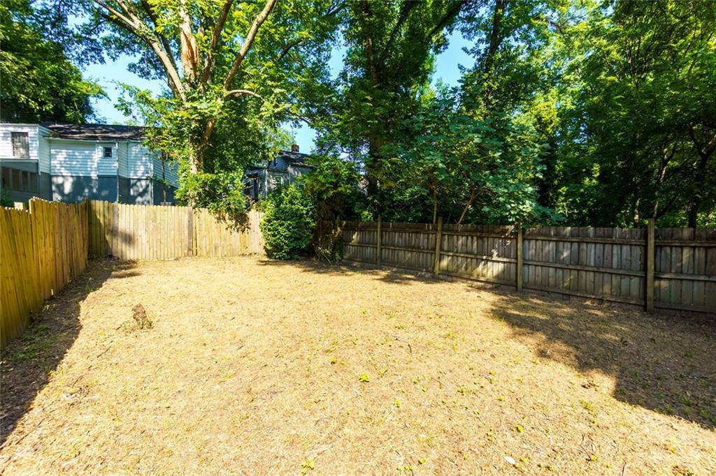 998 Mayson Turner Road Northwest, Unit A Atlanta, GA 30314 - Photo 26 of 26 a view of swimming pool with wooden fence