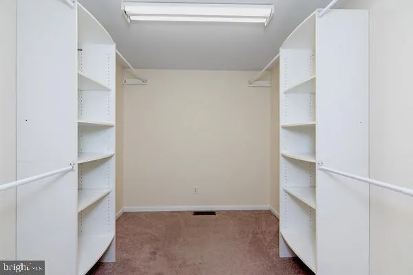 a kitchen that has a refrigerator a stove a oven a sink and a window