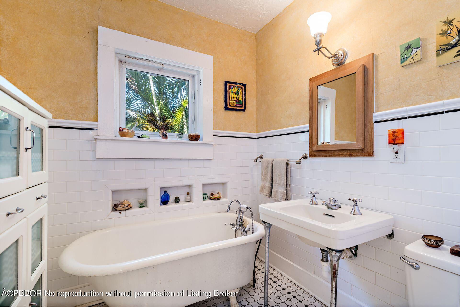810 Avon Road West Palm Beach, FL 33401 - Photo 15 of 23 a white bath tub sitting next to a white sink