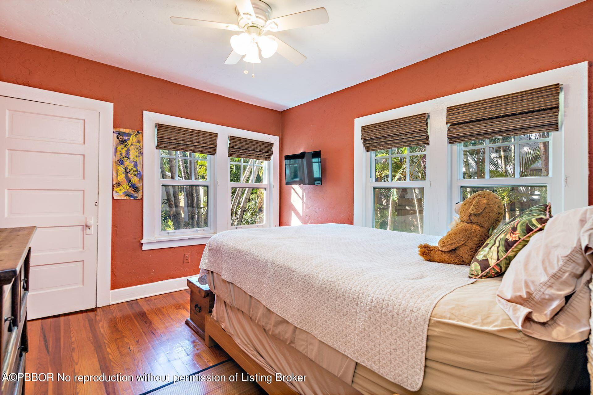 810 Avon Road West Palm Beach, FL 33401 - Photo 16 of 23 a bedroom with a bed and a large window