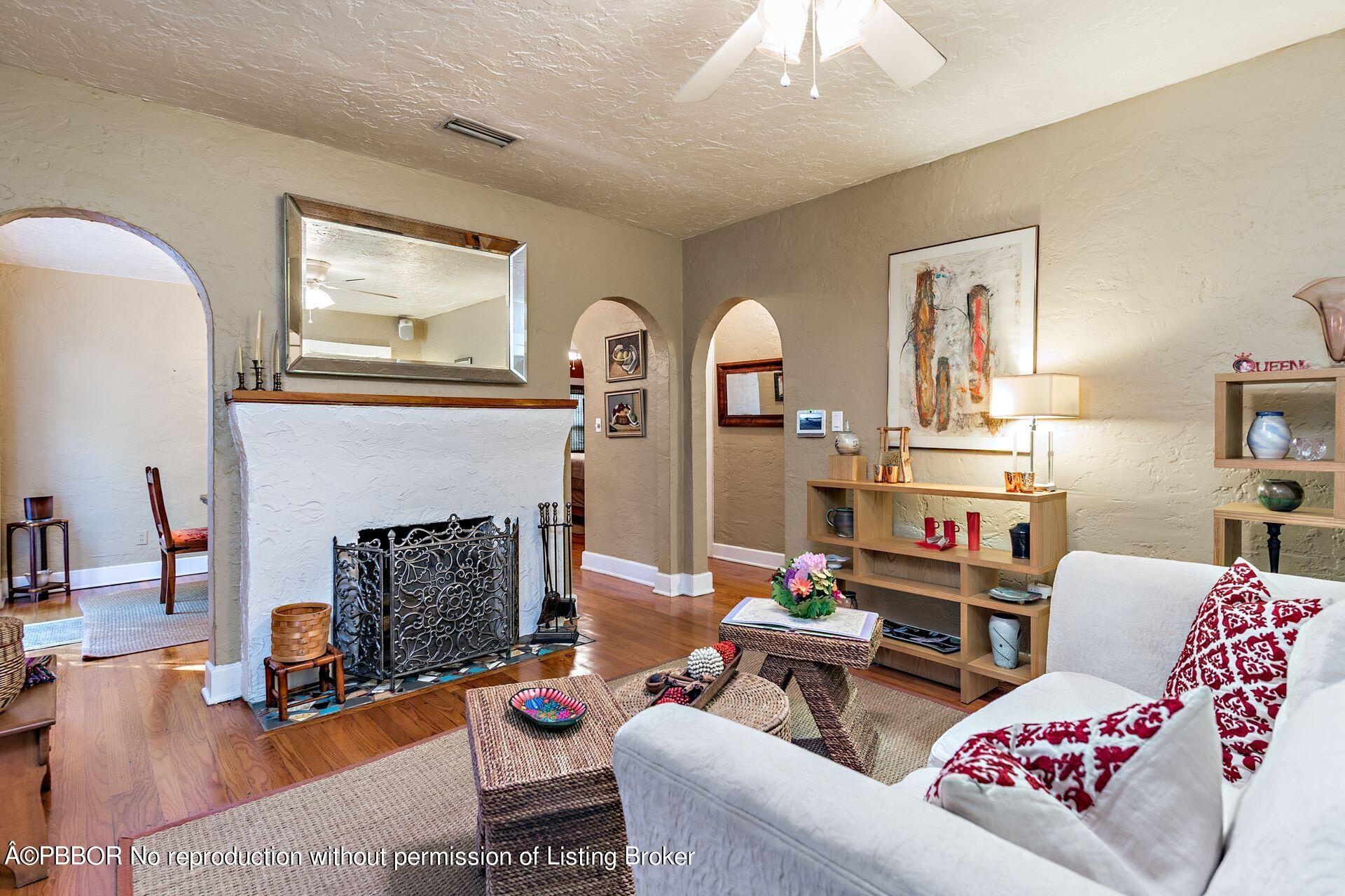 810 Avon Road West Palm Beach, FL 33401 - Photo 5 of 23 a living room with furniture a fireplace and window