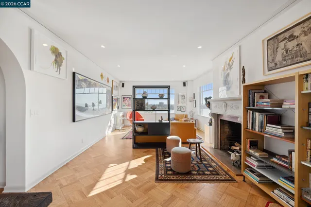 a living room with furniture gym equipment and a fireplace