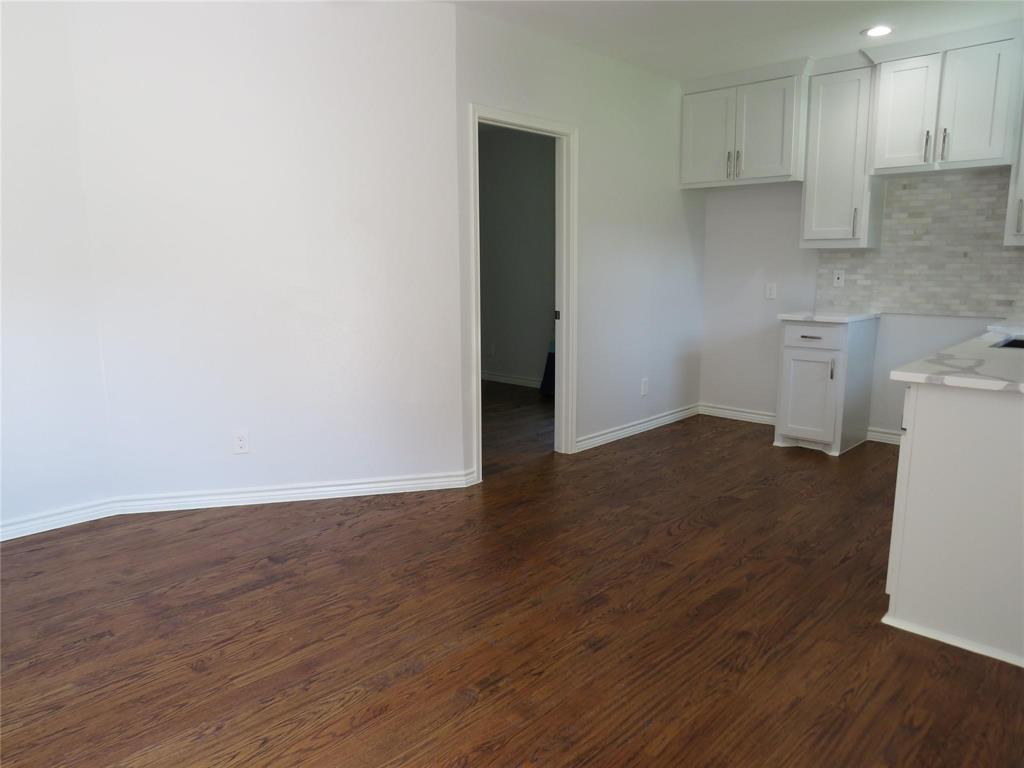 818 Thomas Street Denton, TX 76201 - Photo 4 of 7 a view of a kitchen with wooden floor and a sink