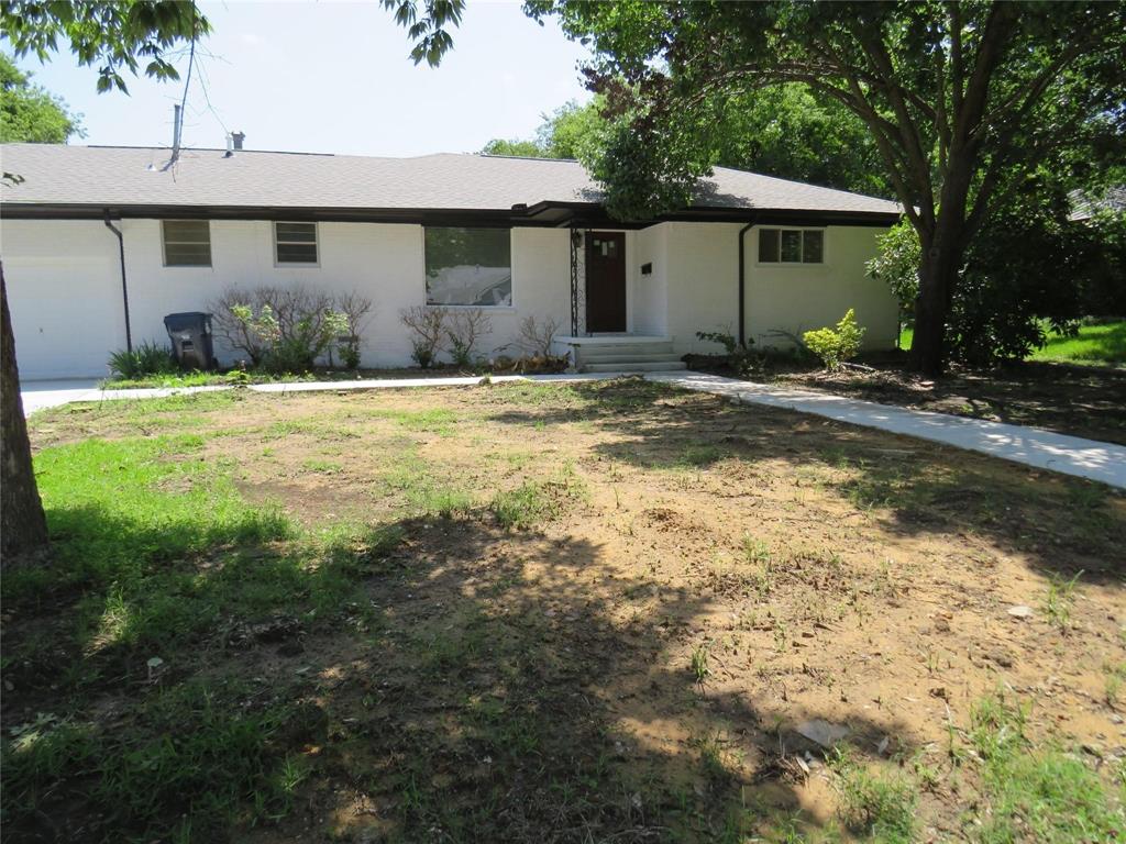 818 Thomas Street Denton, TX 76201 - Photo 7 of 7 a front view of a house with garden