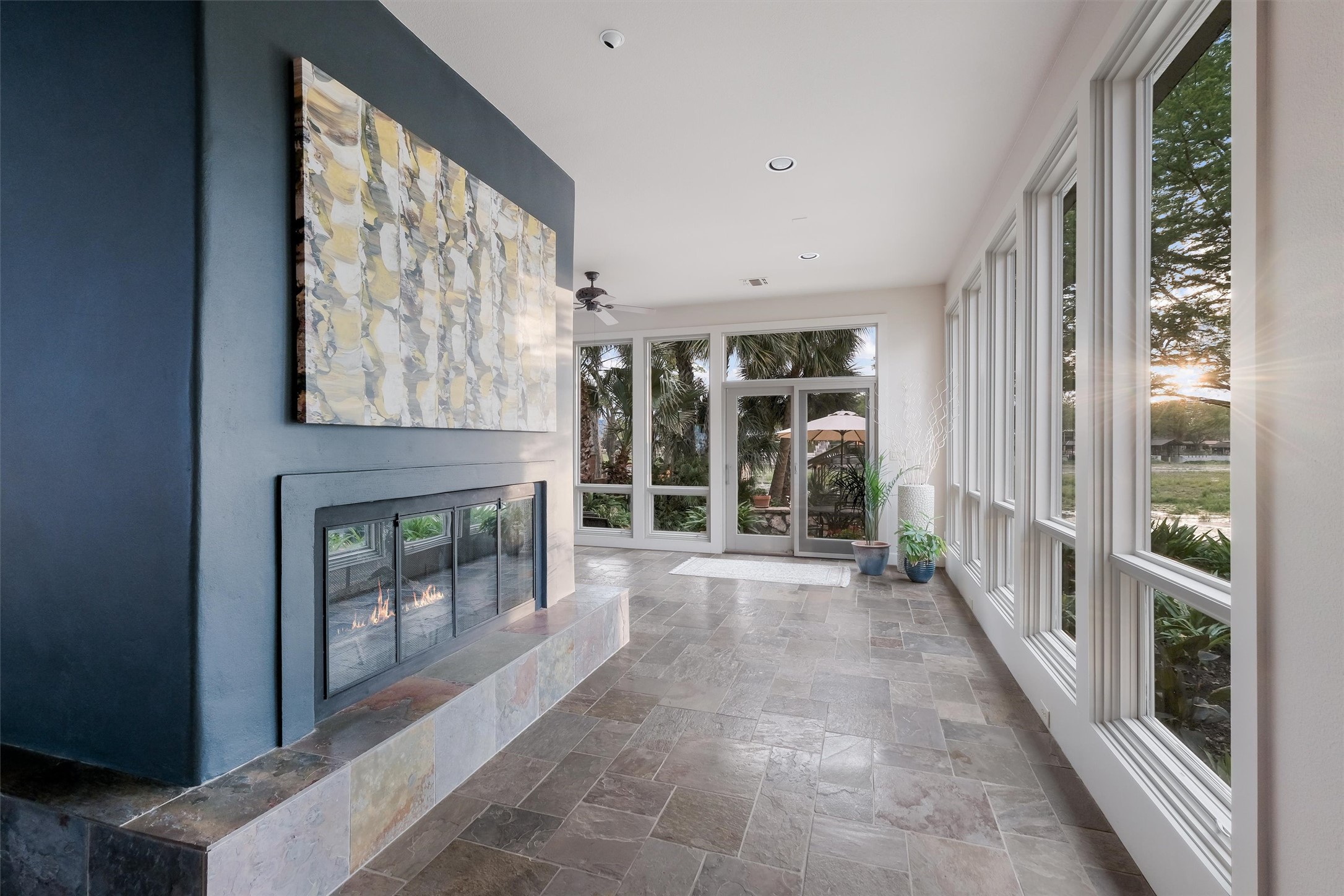 1807 Terminal Loop Road McQueeney, TX 78123 - Photo 20 of 32 View of fireplace and walls of floor to ceiling windows with lake views.