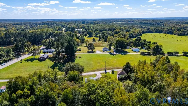 an aerial view of a houses with a lake view