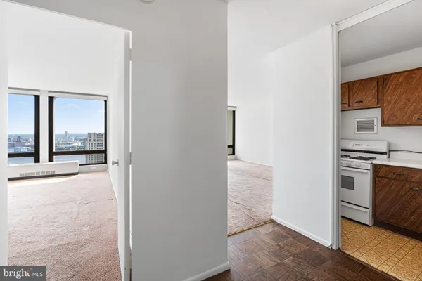 a view of a kitchen cabinets and a stove top oven