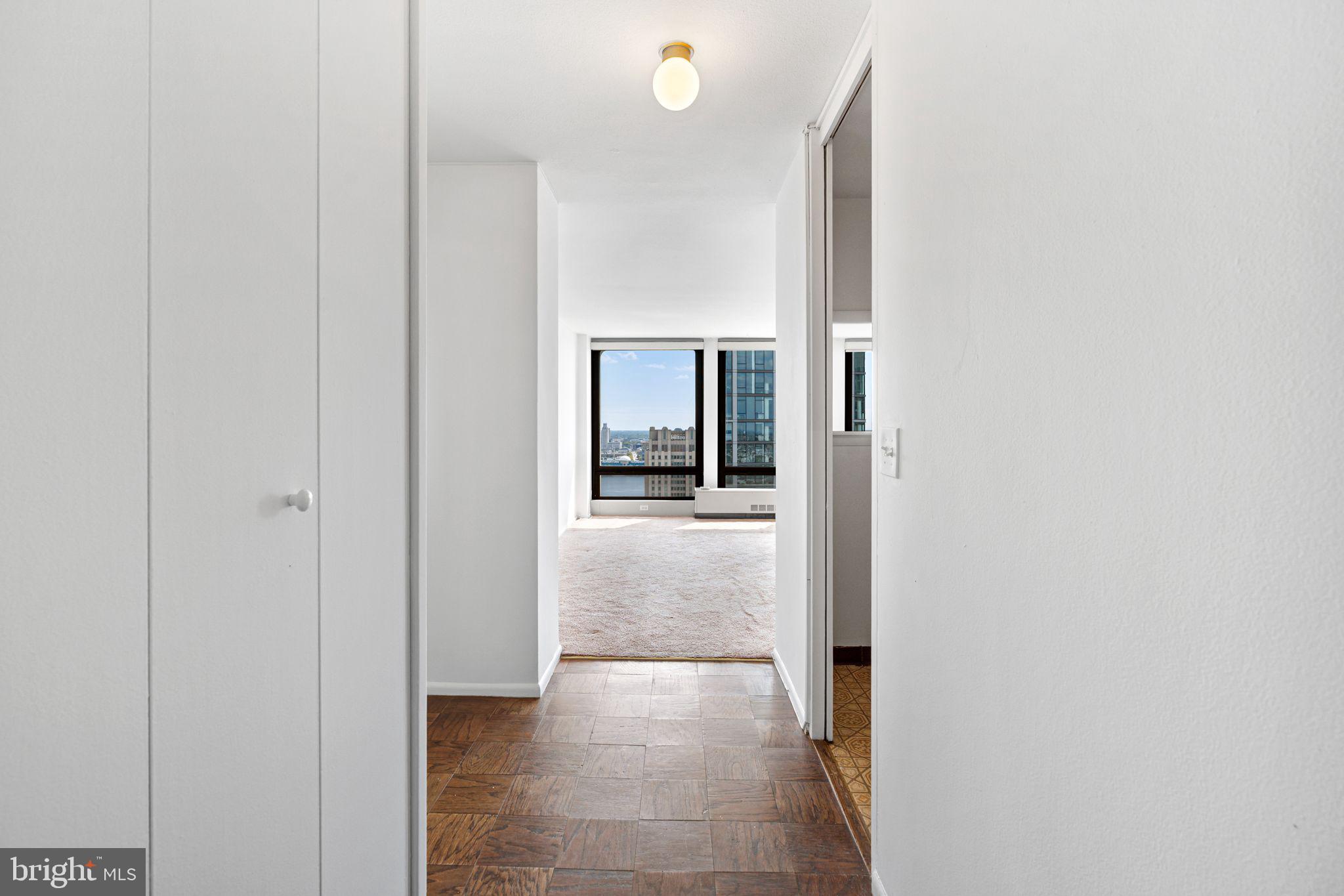 200 Locust Street, Unit 27FN Philadelphia, PA 19106 - Photo 4 of 48 a view of a hallway with wooden shelves