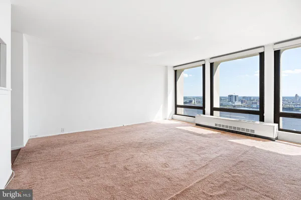 a view of an empty room with a window