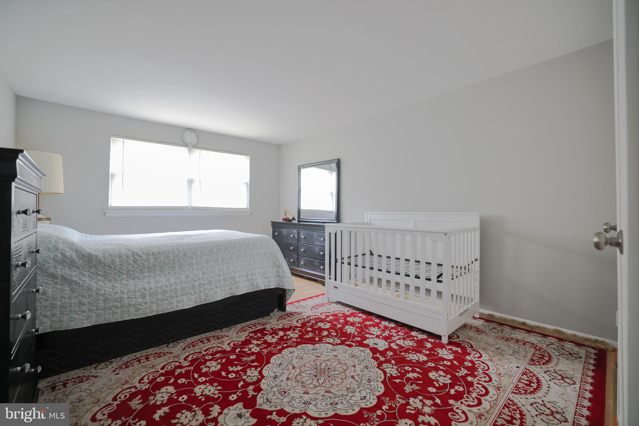 611 Edison Avenue, Unit C Philadelphia, PA 19116 - Photo 11 of 30 a bedroom with a bed and a window