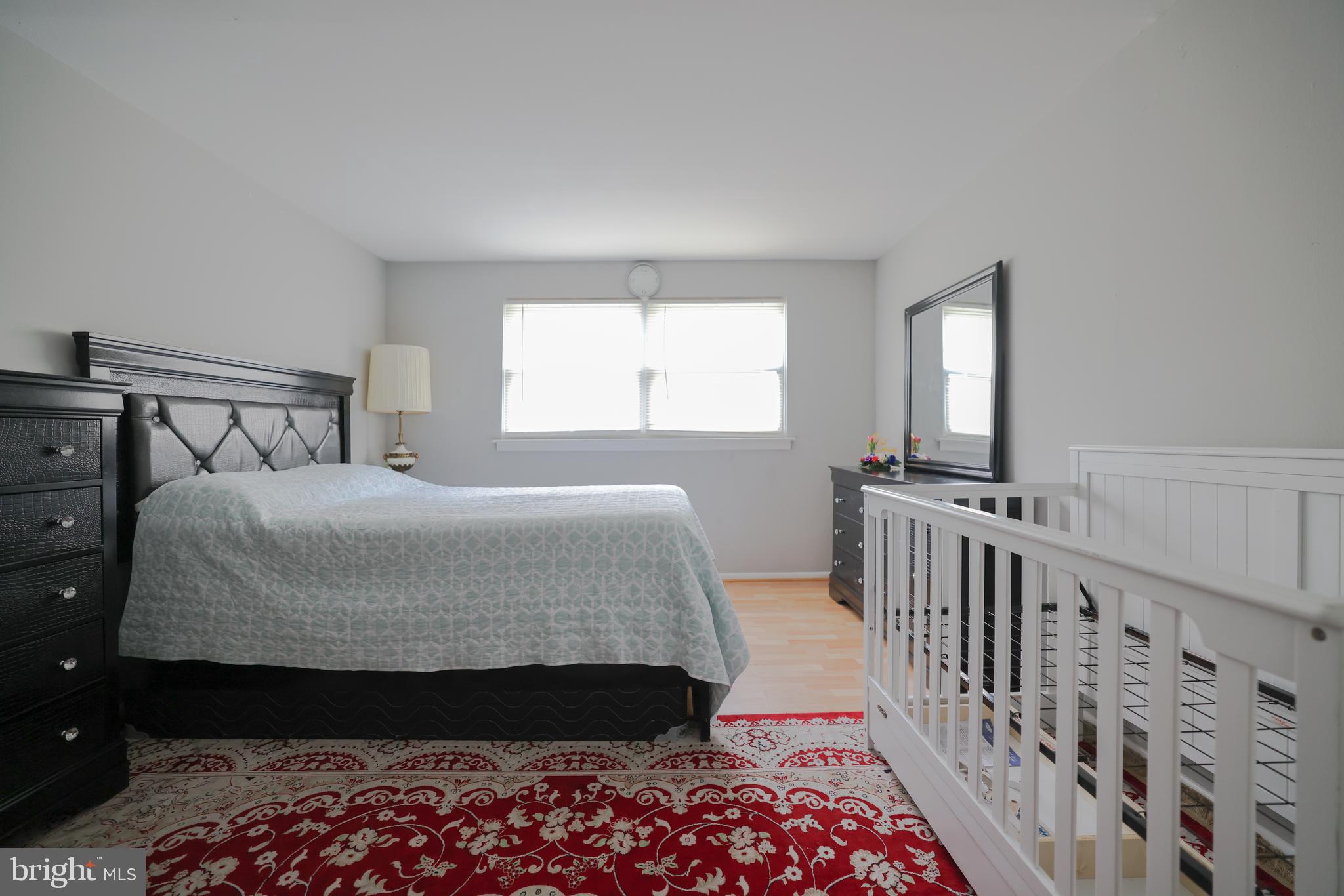 611 Edison Avenue, Unit C Philadelphia, PA 19116 - Photo 13 of 30 a bedroom with a bed and a window