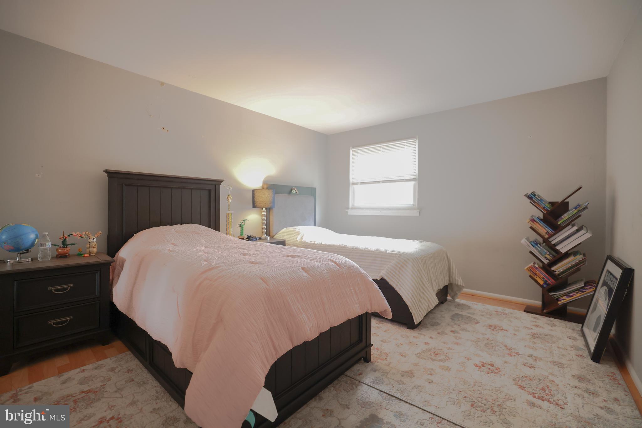 611 Edison Avenue, Unit C Philadelphia, PA 19116 - Photo 18 of 30 a bedroom with a bed and a painting on the wall
