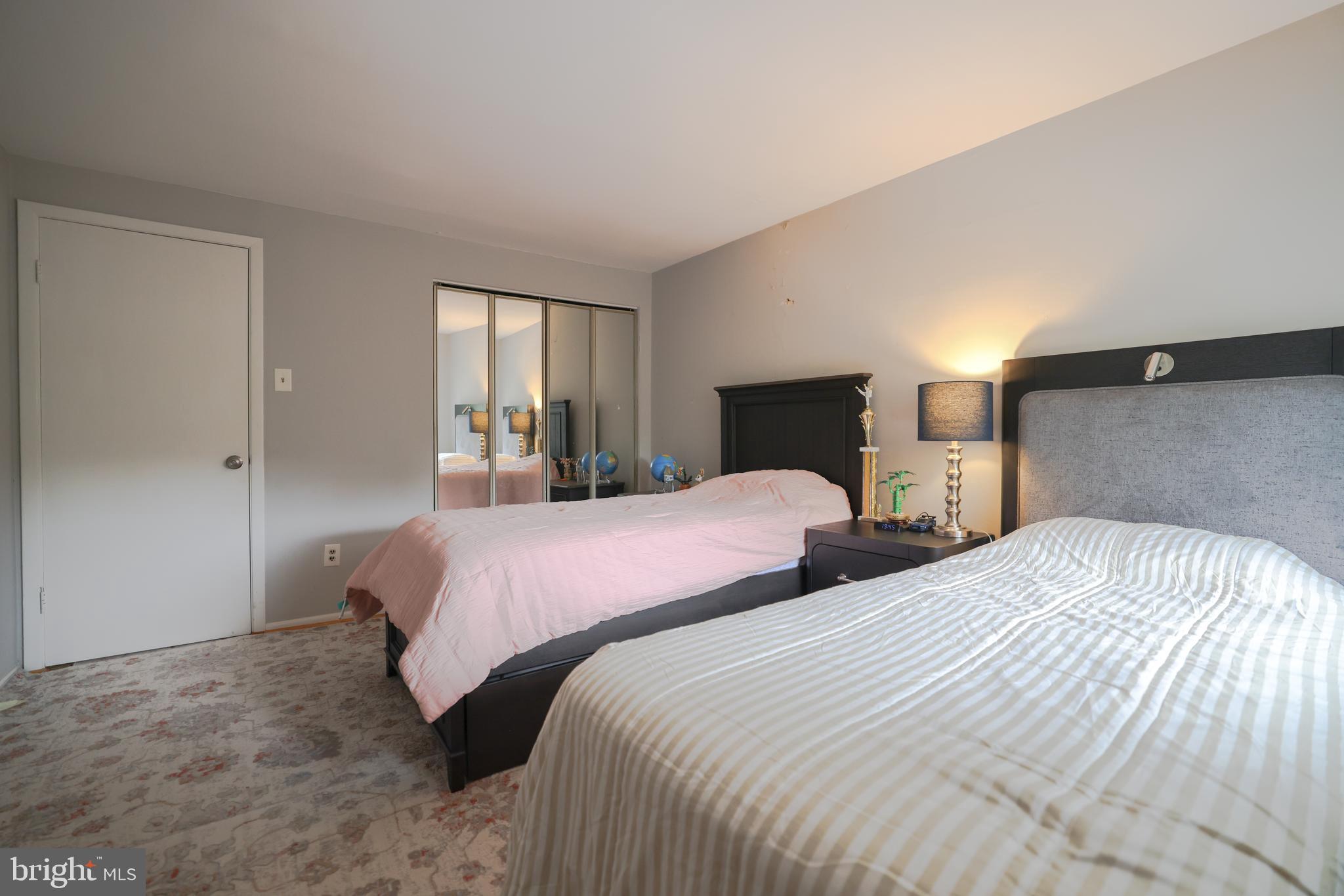 611 Edison Avenue, Unit C Philadelphia, PA 19116 - Photo 19 of 30 a bedroom with two beds and a window