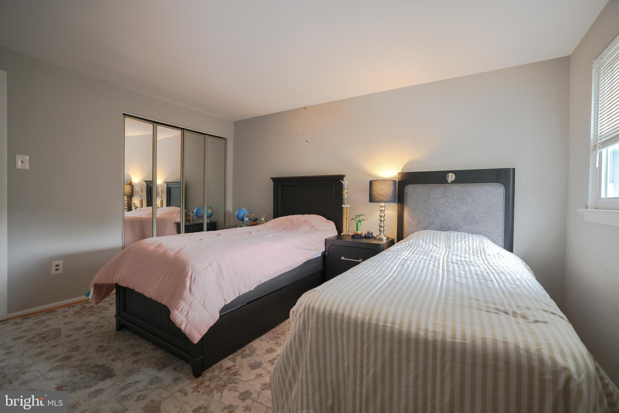 611 Edison Avenue, Unit C Philadelphia, PA 19116 - Photo 20 of 30 a bedroom with two beds and a window