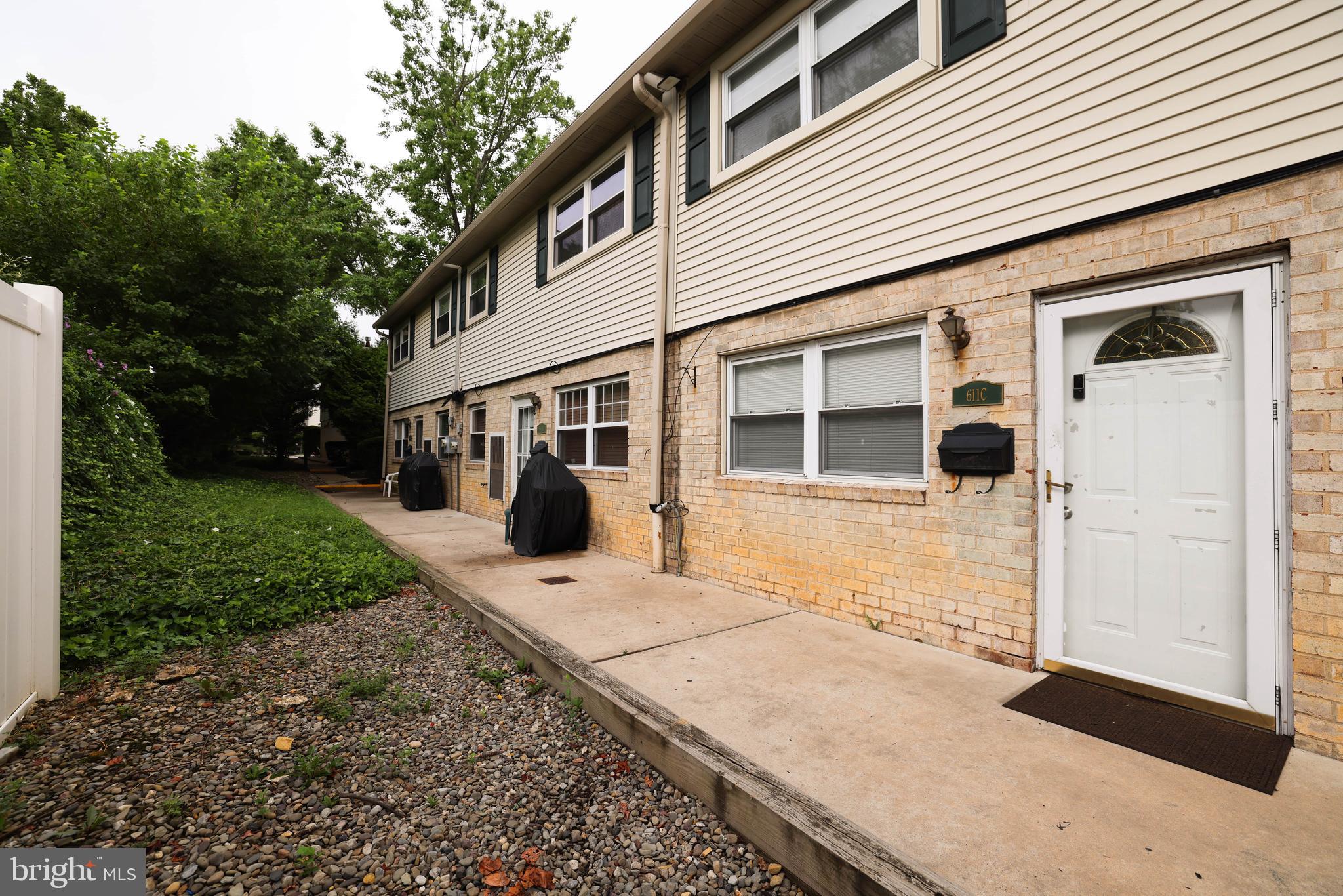 611 Edison Avenue, Unit C Philadelphia, PA 19116 - Photo 29 of 30 a front view of a house with a yard and garage
