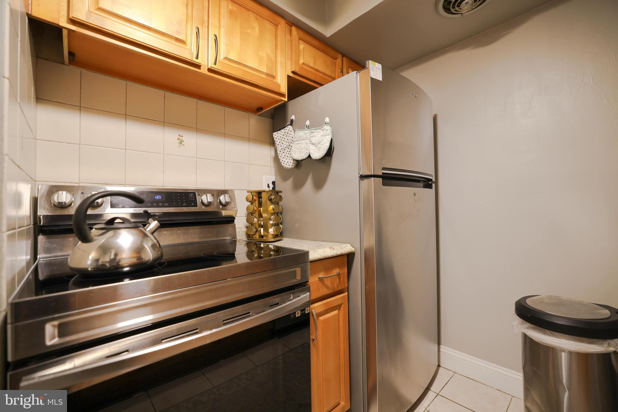 611 Edison Avenue, Unit C Philadelphia, PA 19116 - Photo 4 of 30 a close view of stove and refrigerator