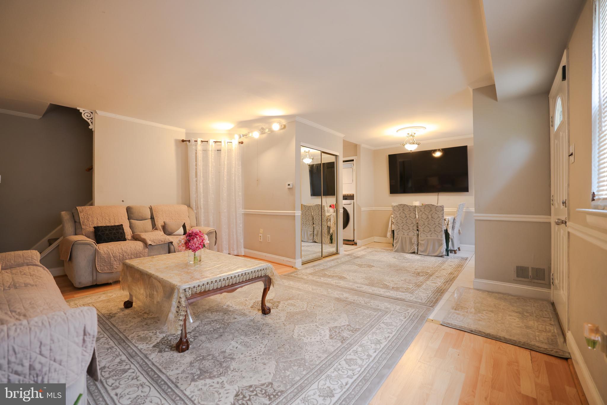 611 Edison Avenue, Unit C Philadelphia, PA 19116 - Photo 7 of 30 a living room with furniture and a flat screen tv