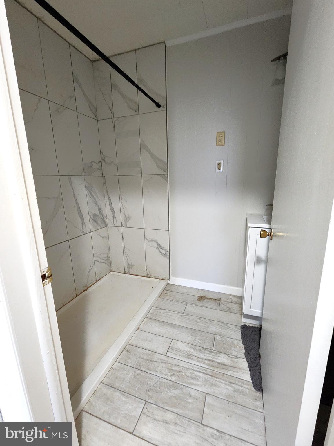 8754 Concord Road Seaford, DE 19973 - Photo 13 of 21 a bathroom with a sink and shower