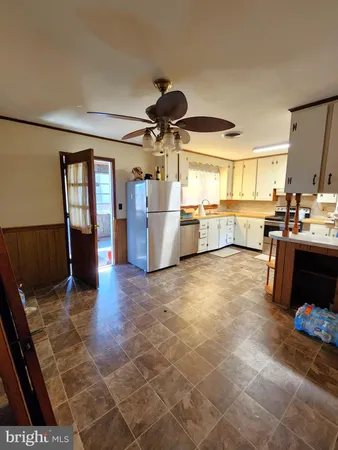 a kitchen with a sink and a stove top oven
