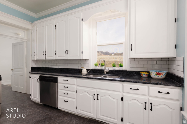 1331 South Lowry Hl Road Manti, UT 84642 - Photo 24 of 56 Kitchen with white cabinets, dishwasher, decorative backsplash, dark stone countertops, and ornamental molding