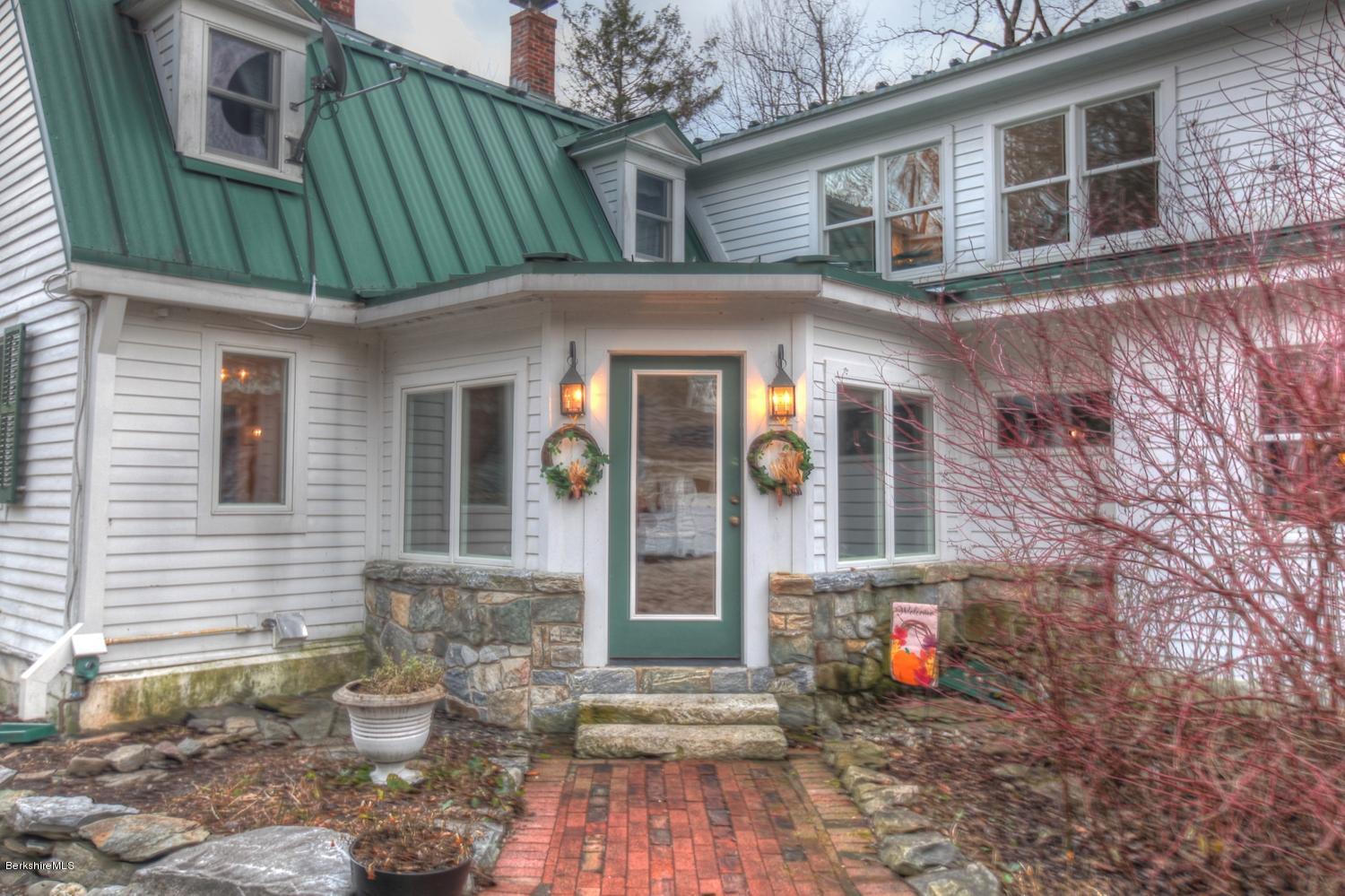 1226 State Road Richmond, MA 01254 - Photo 12 of 50 a front view of a house with garden