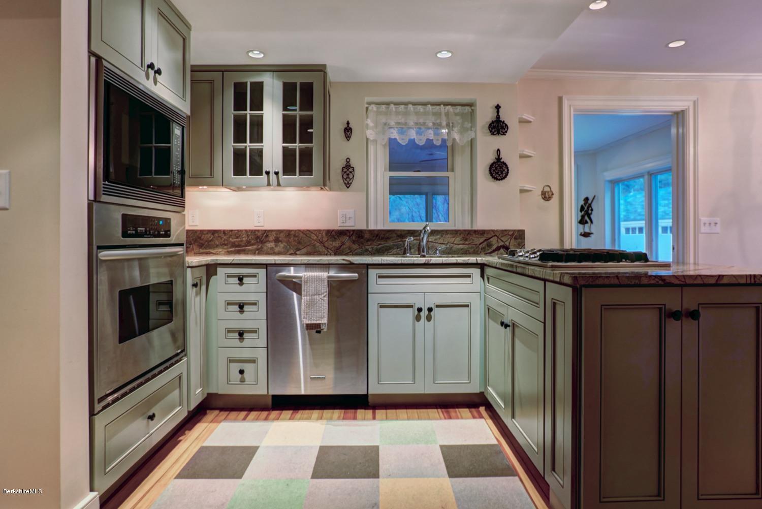 1226 State Road Richmond, MA 01254 - Photo 17 of 50 a kitchen with granite countertop a stove a sink and a microwave