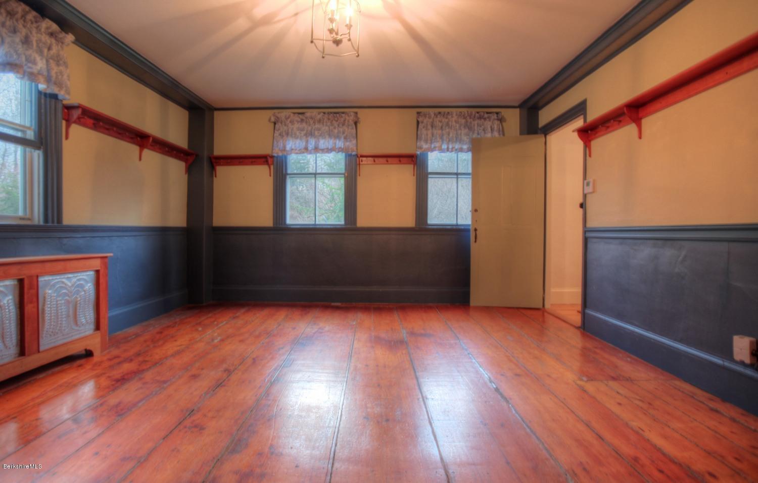 1226 State Road Richmond, MA 01254 - Photo 21 of 50 a view of an empty room with wooden floor and a window