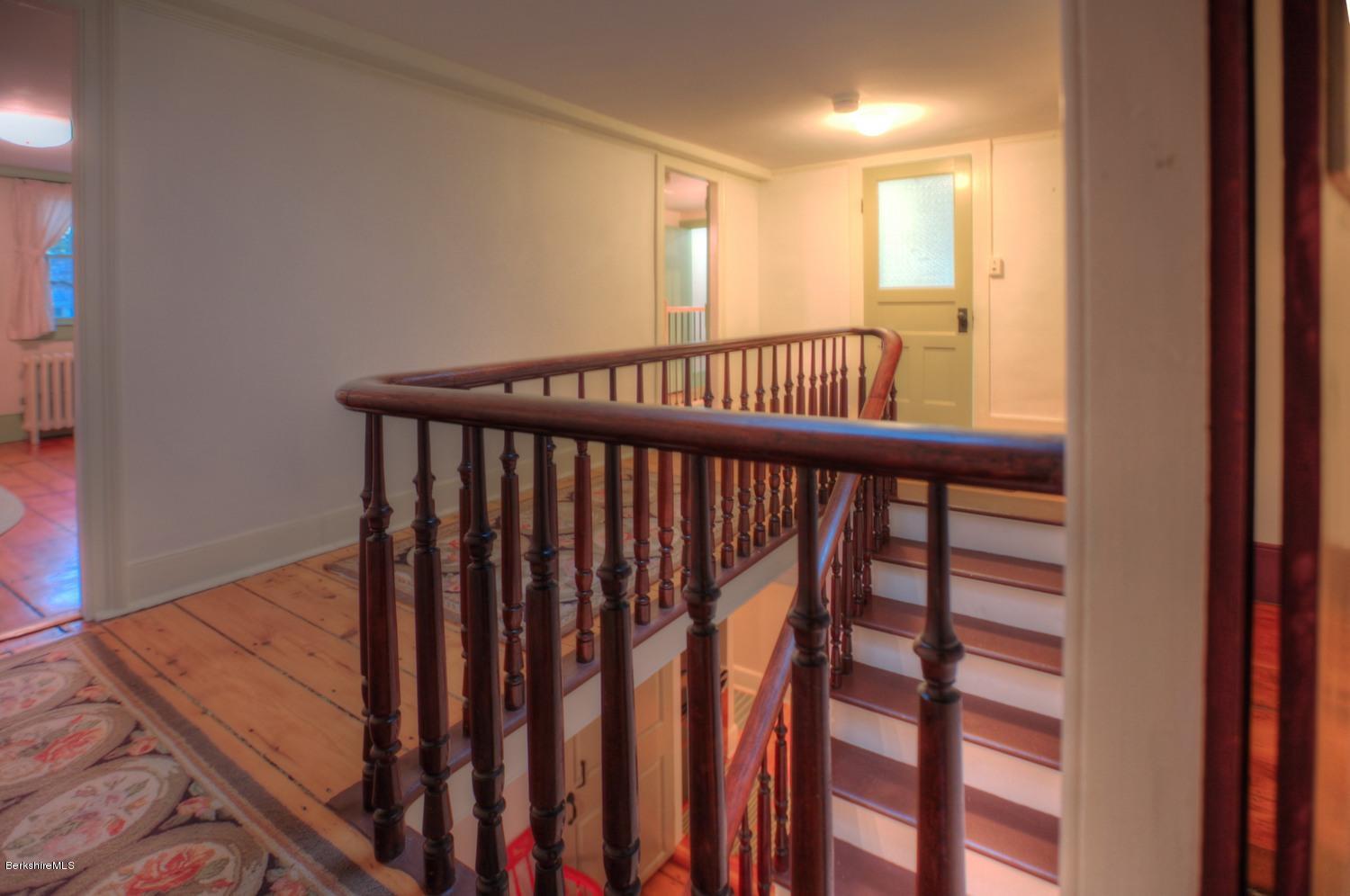1226 State Road Richmond, MA 01254 - Photo 22 of 50 a view of a hallway with wooden floor and windows