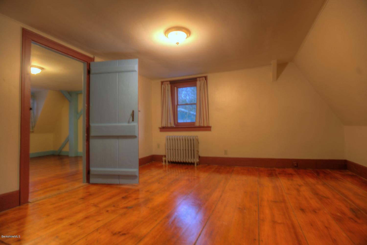1226 State Road Richmond, MA 01254 - Photo 33 of 50 an empty room with wooden floor and windows