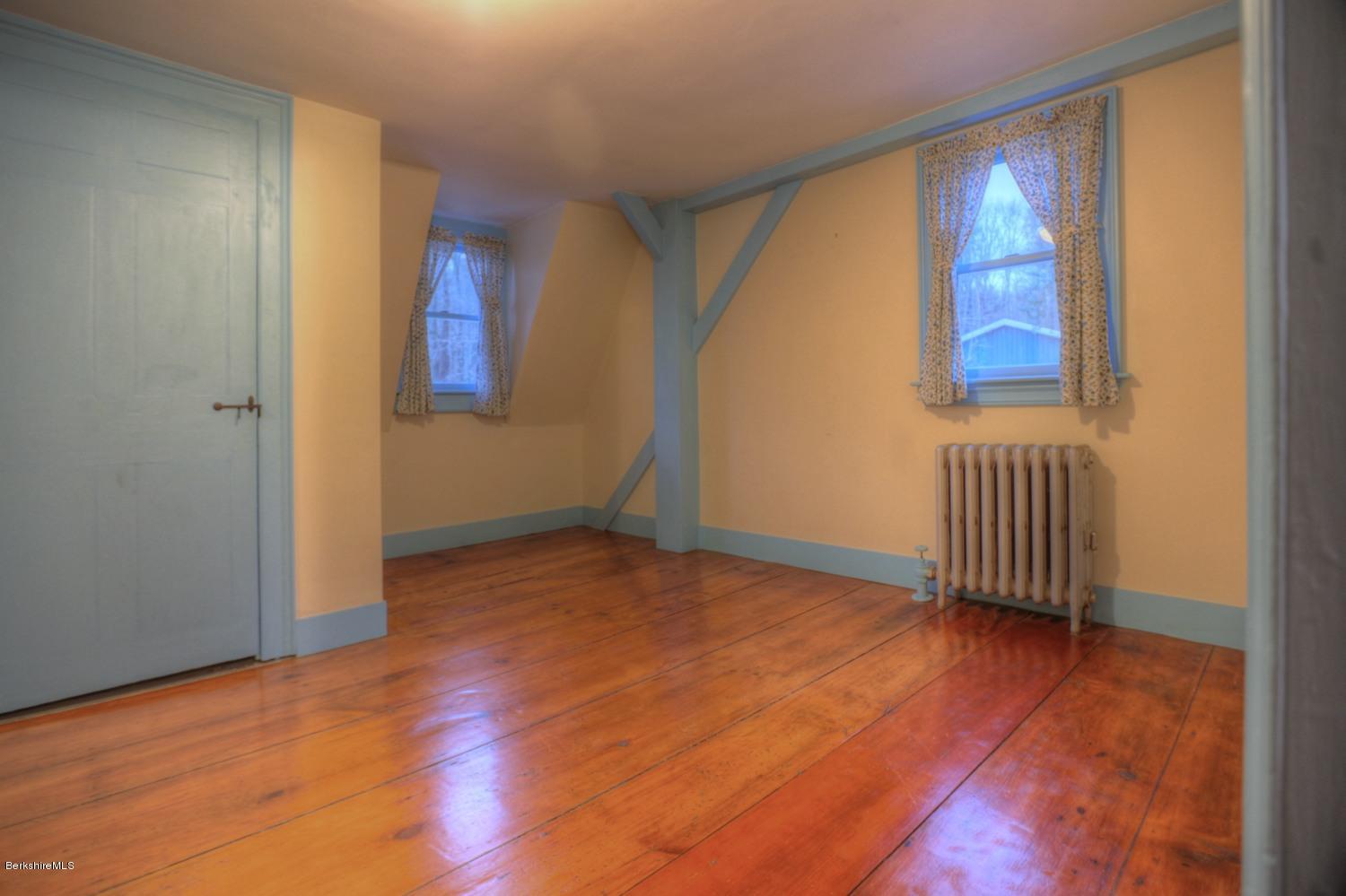 1226 State Road Richmond, MA 01254 - Photo 34 of 50 a view of an empty room with a window and wooden floor