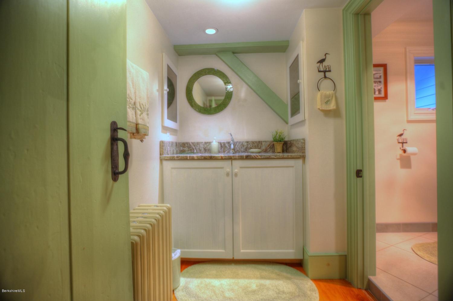 1226 State Road Richmond, MA 01254 - Photo 35 of 50 a bathroom with a sink and a mirror