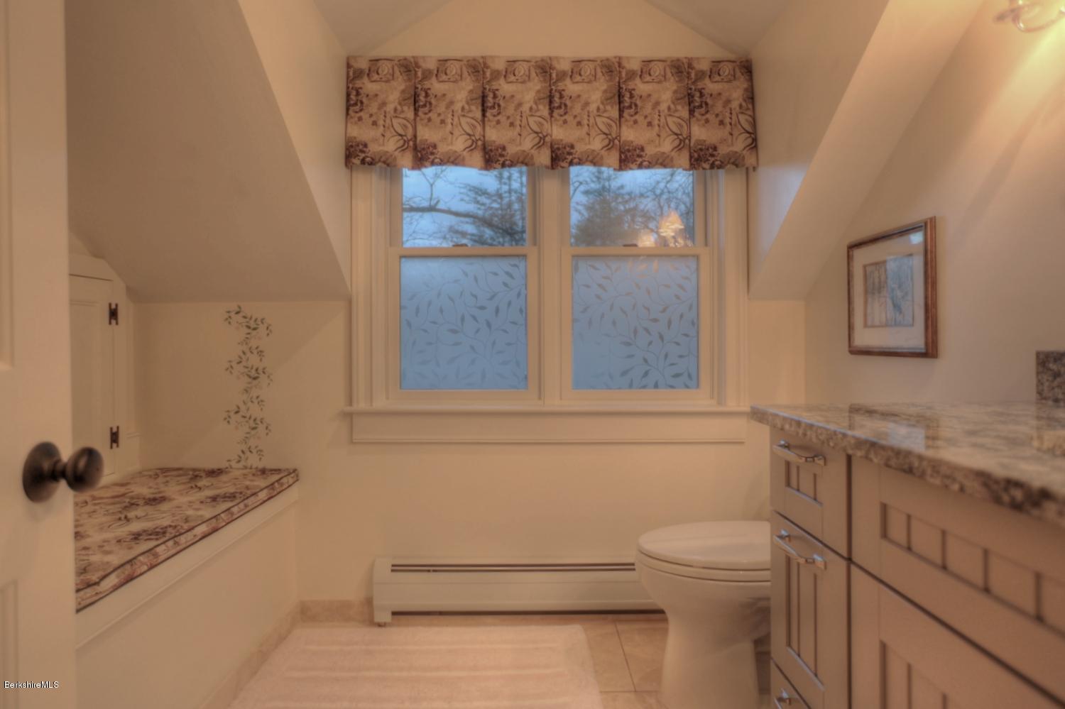 1226 State Road Richmond, MA 01254 - Photo 46 of 50 a bathroom with a granite countertop sink a toilet and shower