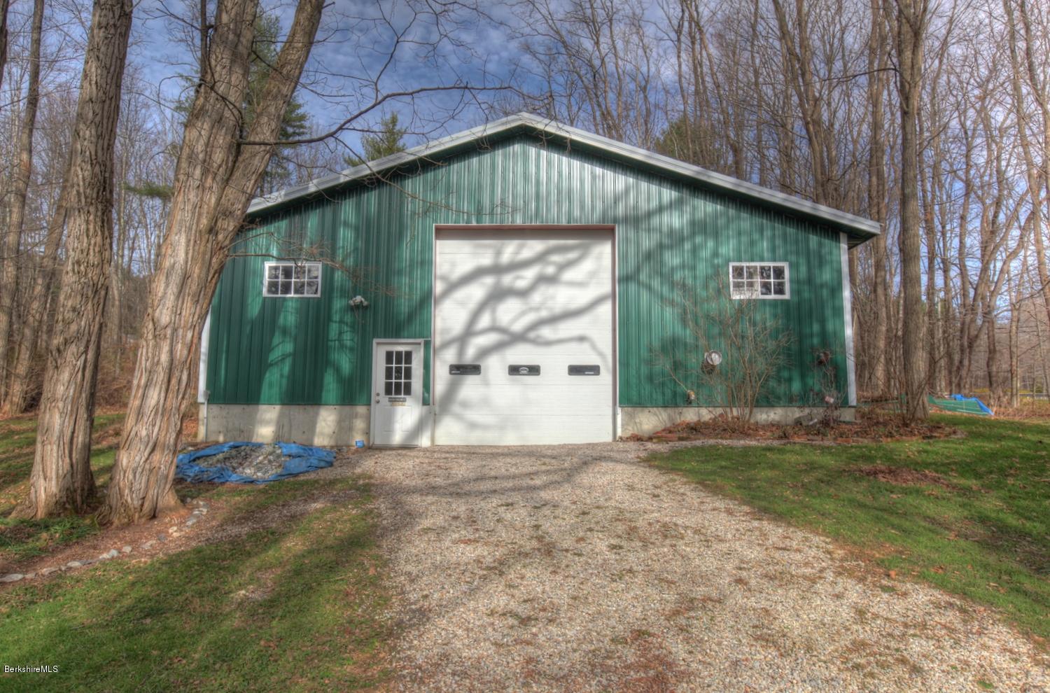 1226 State Road Richmond, MA 01254 - Photo 47 of 50 a front view of a house with a garden