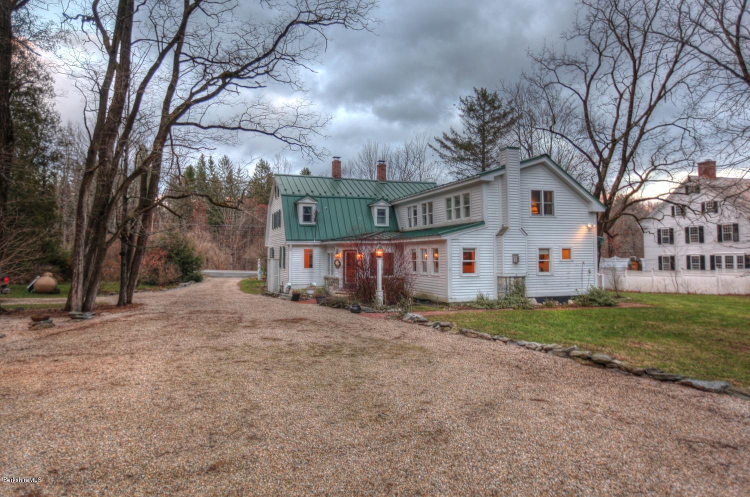 1226 State Road Richmond, MA 01254 - Photo 6 of 50 a view of a white house next to a yard with big trees and a big yard