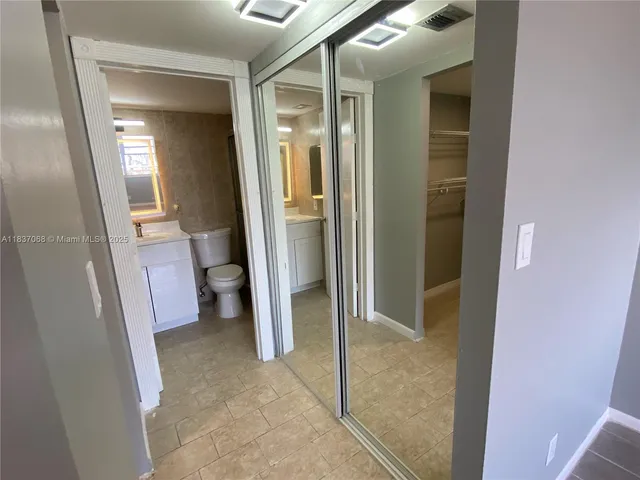 a view of a bathroom from the hallway