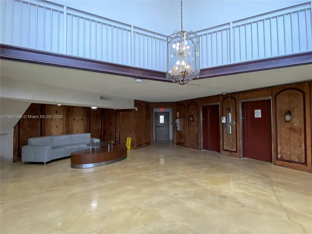 a view of a livingroom with furniture and chandelier