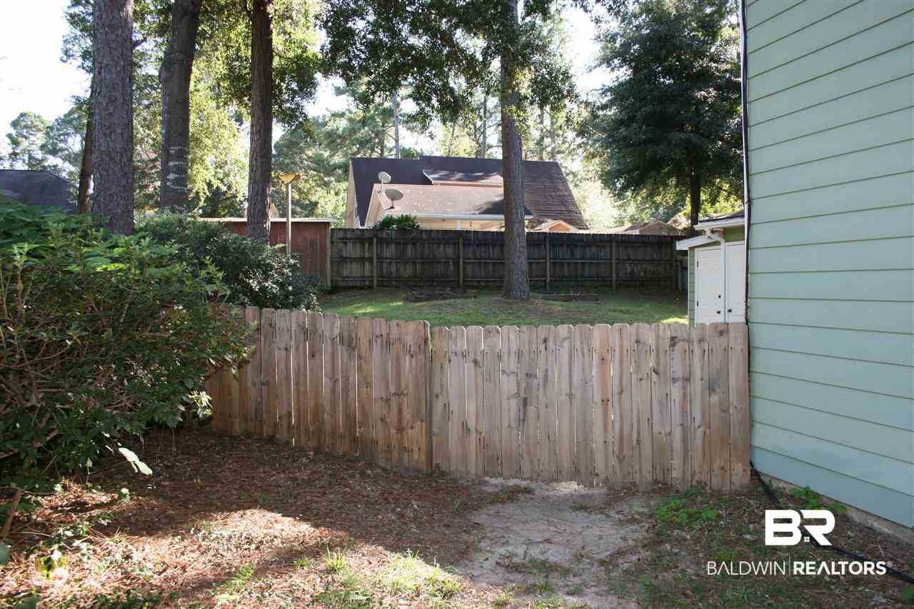 102 Meadow Wood Loop Daphne, AL 36526 - Photo 30 of 33 Backyard fence