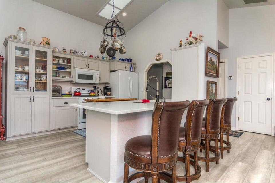 3393 Northeast Stonebrook Loop Bend, OR 97701 - Photo 8 of 23 Newly remodeled kitchen and dining bar with LVP flooring